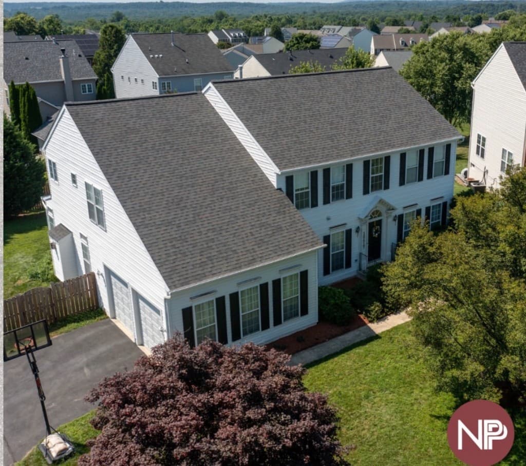 The same colonial home after the completed architectural shingle roof