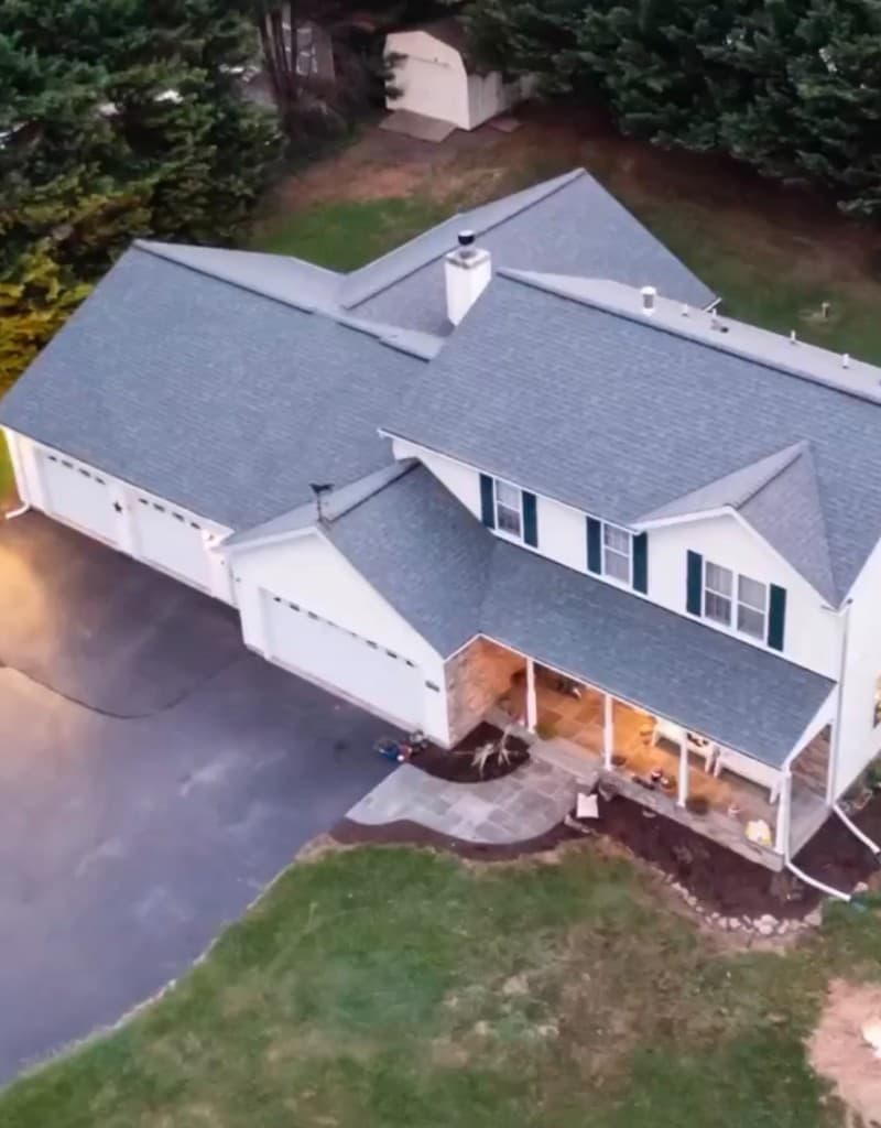 Completed New Paradigm Projects residential roof at dusk